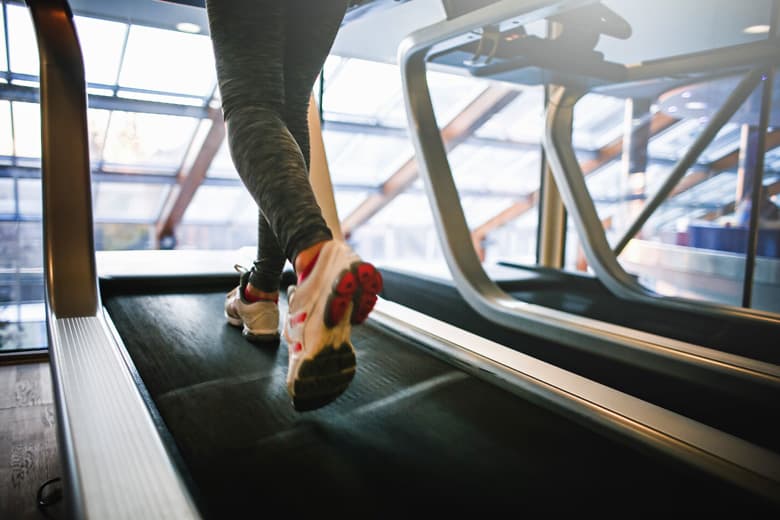 woman running on treadmill