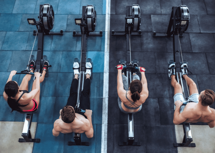 Group of athletes on rowing machine