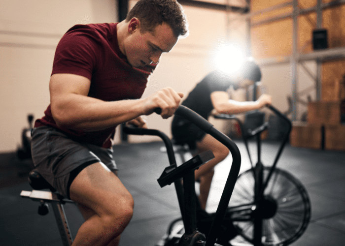 Men Riding a Stationary Bike at the Gym