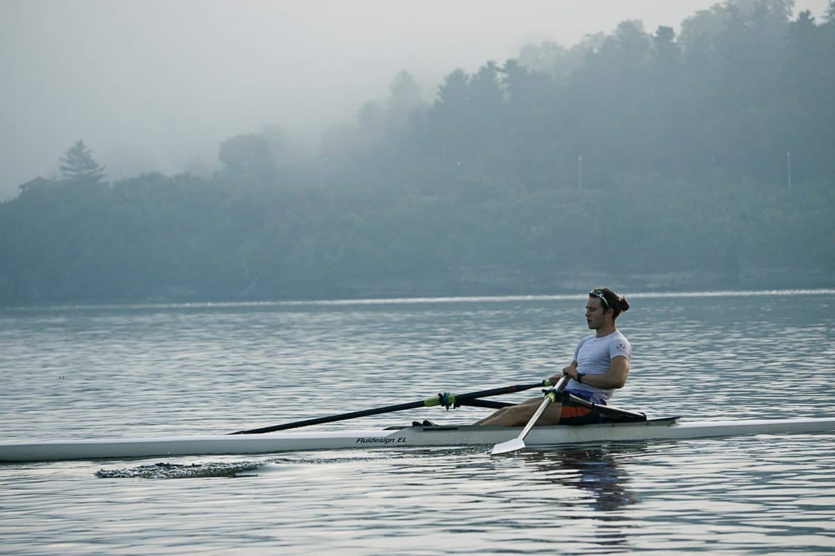 Man rowing on a foggy day