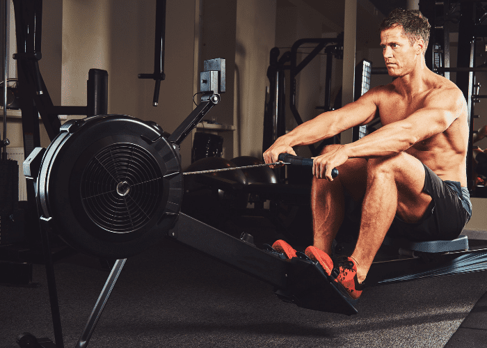Male doing exercise on rowing machine
